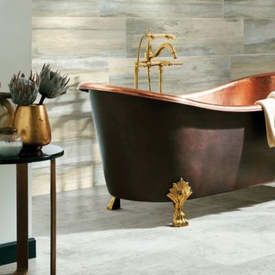 bathroom renovation with freestanding tub and wood tile accent wall